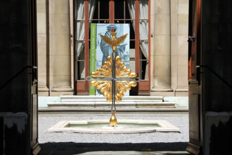 Golden peace dove in the courtyard of the Reformation Museum in Geneva