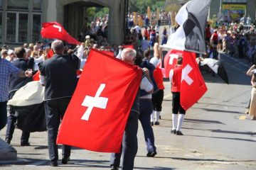 Swiss Flags at the Désalpe des Quinquas Parade in Fribourg, Switzerland