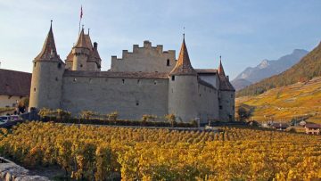 Autumn colors surrounds the Chateau d'Aigle Castle in Switzerland