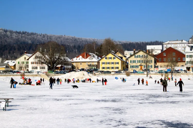 Le Pont viewed from a frozen Lac de Joux in Switzerland