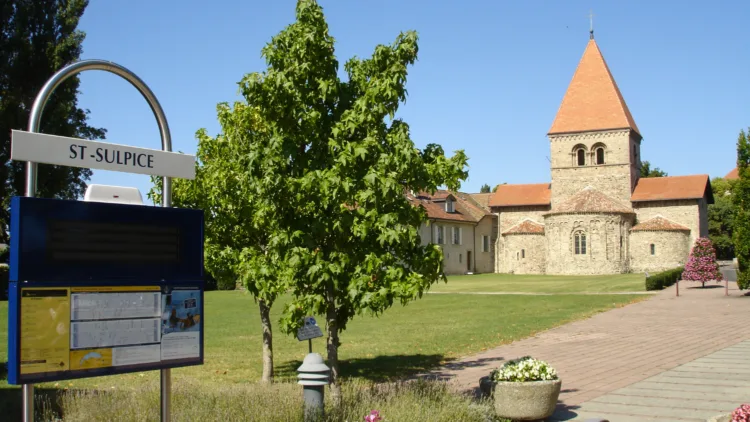 Romanesque St Sulpice Church with Lake Geneva boat time tables