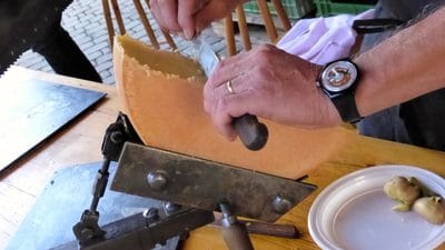 Preparing Raclette at a wine-tasting event in Switzerland