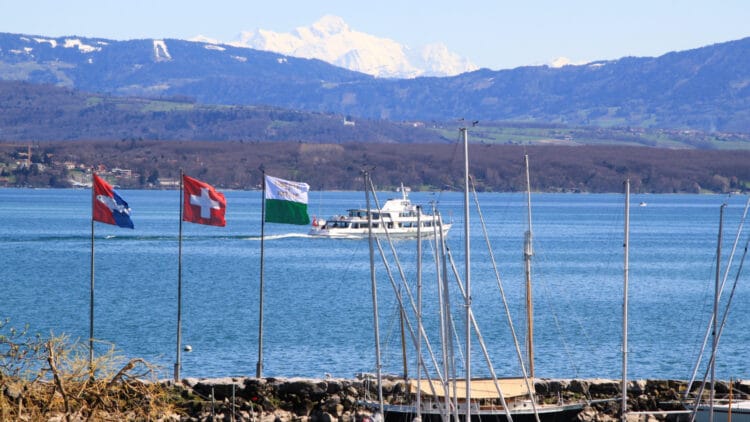 Mt Blanc seen from Nyon with a CGN boat cruising on Lake Geneva in Switzerland